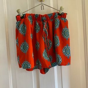 Red patterned shorts. Made out of flowy material and great for hot weather.